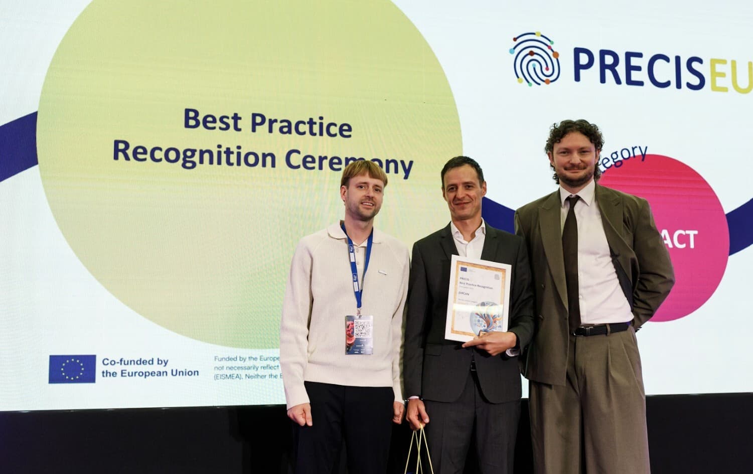 Miquel A. Bru holding the Best Practice Recognition Award at the PRECISEU ceremony